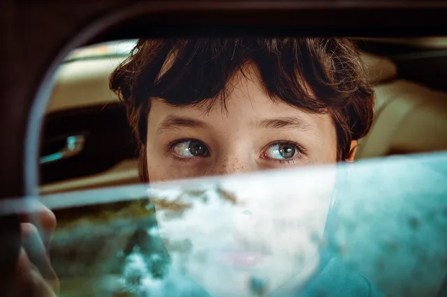 boy, face, car window, portrait, teen, teenager, young, eyes, car wallpapers, window, glass, reflection, car, closeup, photoshoot. How California tint law and DMV rules affect every Los Angeles shop job