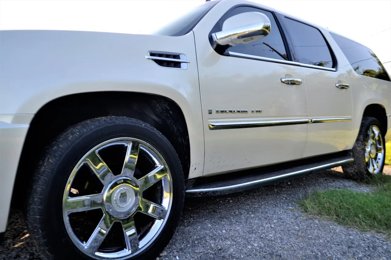 pre-owned, cadillac escalade, front, side door, panel, angle, view, rear view mirror, tinted windows, nature, sky, sunny, grass, wheel, tire, beige, sports utility, vehicle, suv, car, used car, automobile, all-wheel, automotive, transport, driving, 4x4, car wallpapers, taillight, break light, gas cap, back door, bumper, high, raised, street, parked, transportation, auto, modern, side, speed, sport, drive, road, outdoor, travel, asphalt, day, empty, summer, used, car sales, dealership, car salesman, used car sales, disk, star, drum, roller, caster, circuit, circulation, circumvolution, cycle, gyration, gyre, hoop, pivot, pulley, ratchet, ring, roll, rotation, round, spin, trolley, turn, twirl, whirl, convertible, jeep, limousine, machine, motor, pickup, ride, station wagon, truck, van, wagon, bucket, buggy, compact, conveyance, coupe, hardtop, heap, jalopy, junker, motorcar, blue car, blue door, blue truck, blue sales. Vehicle Wrap Tinting: Fleet Account Operations